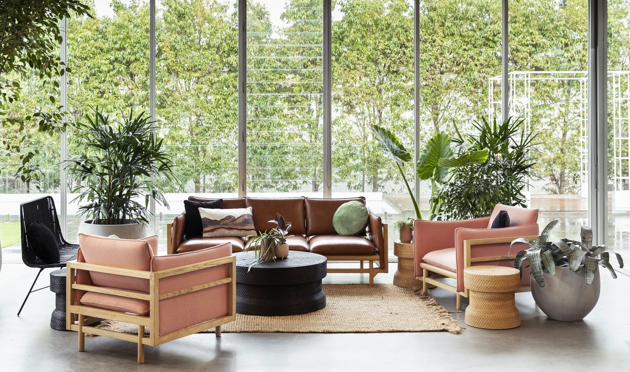 Modern seating furniture with green garden outlook.